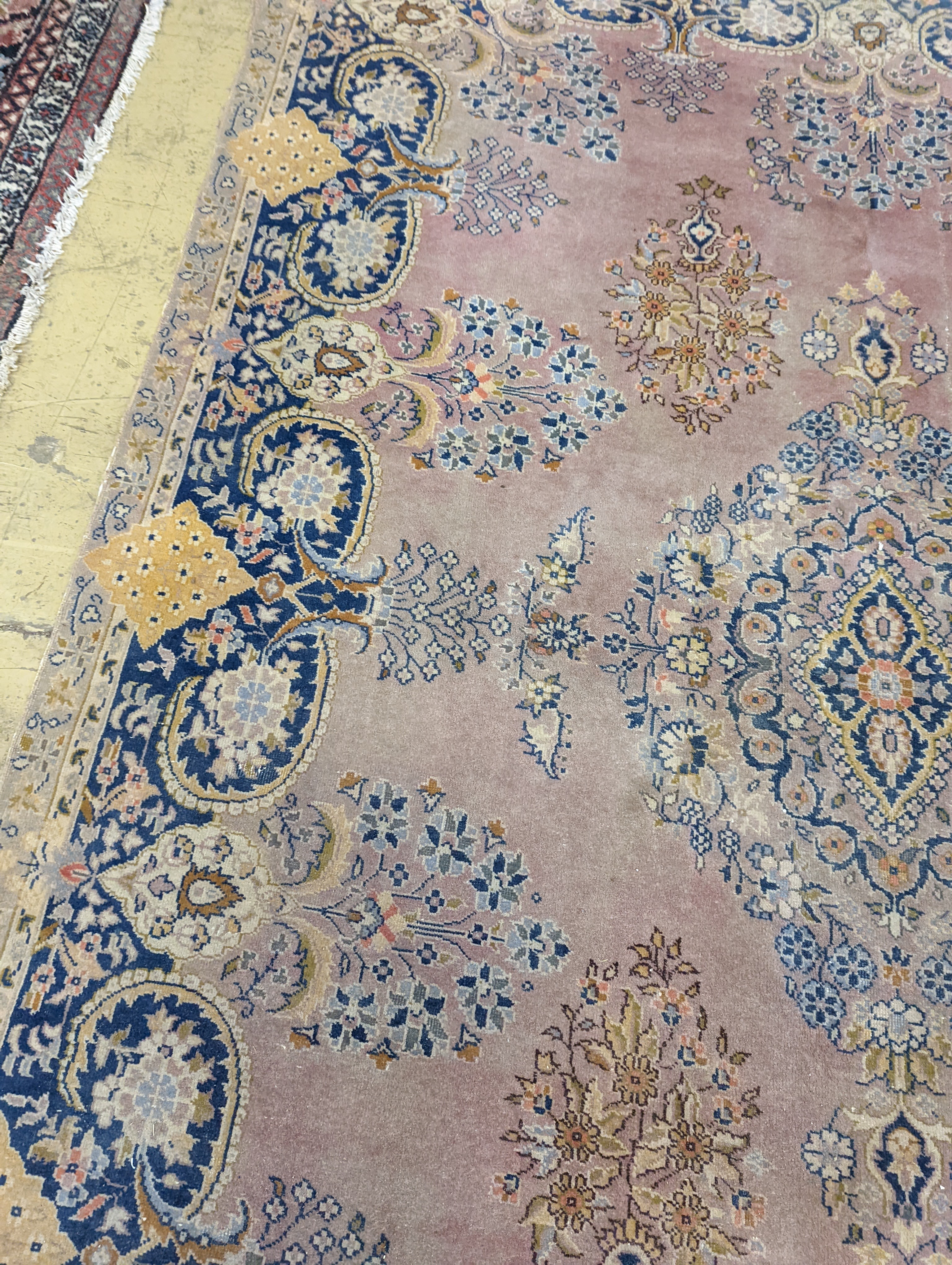 A North West Persian design peach ground carpet, 250 x 170cm